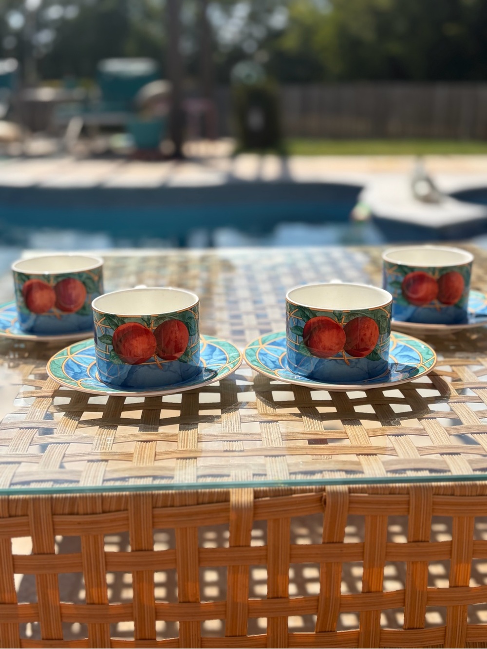 Victoria Beckham Blue Teacup and Saucer Set with Red Fruit Motif